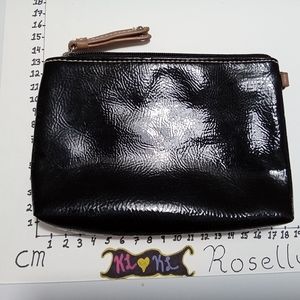 Small black clutch. No tags. Material unknown . Zipper in great condition.